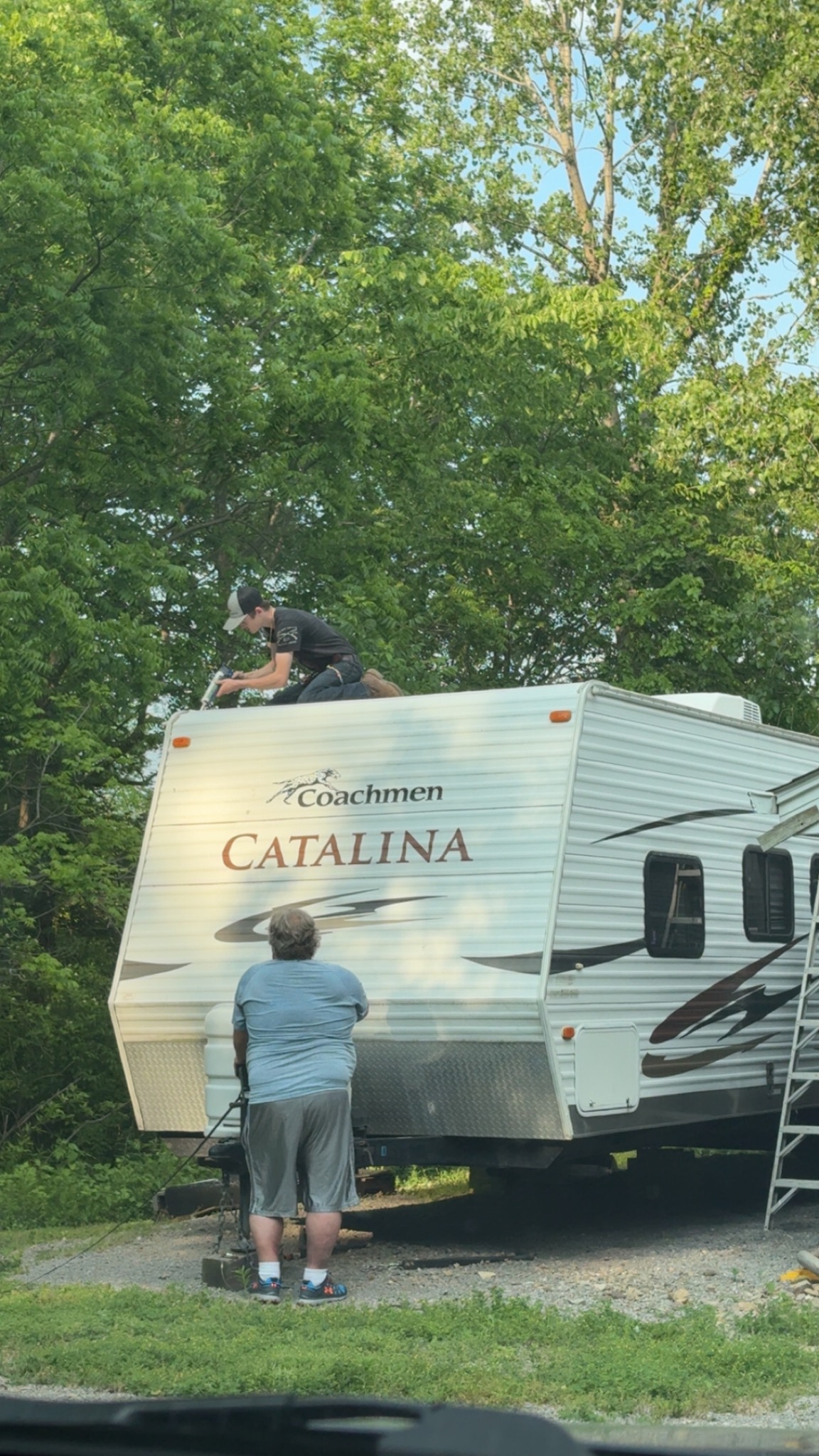 Andrew performing RV roof inspection and sealant service